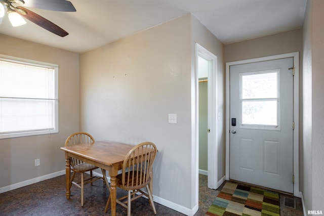 12855 Cleveland Ln, Pittsburg, IL 62974 - dining room with visible vents, a wealth of natural light, a ceiling fan, and baseboards
