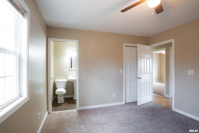 12855 Cleveland Ln, Pittsburg, IL 62974 - unfurnished bedroom featuring carpet flooring, baseboards, and connected bathroom