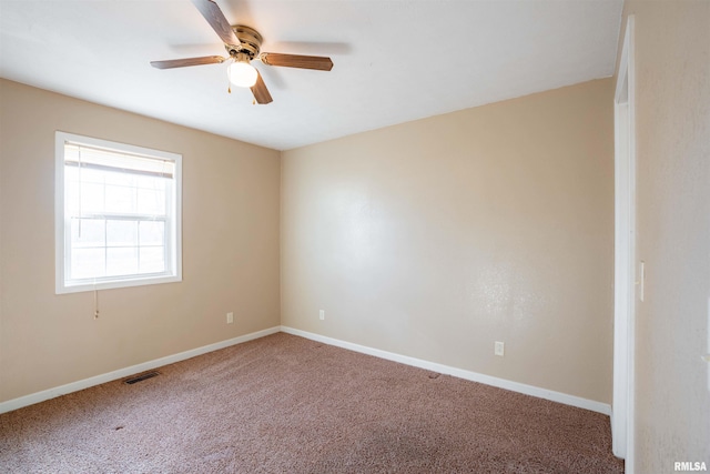 12855 Cleveland Ln, Pittsburg, IL 62974 - unfurnished room with baseboards, a ceiling fan, visible vents, and carpet floors