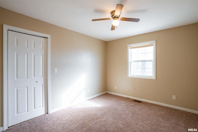 12855 Cleveland Ln, Pittsburg, IL 62974 - empty room featuring visible vents, baseboards, a ceiling fan, and carpet