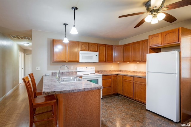 12855 Cleveland Ln, Pittsburg, IL 62974 - kitchen with ceiling fan, white appliances, a peninsula, visible vents, and a sink
