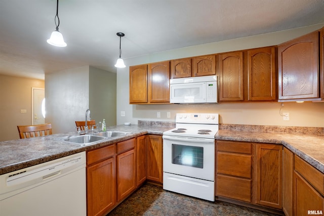 12855 Cleveland Ln, Pittsburg, IL 62974 - kitchen featuring brown cabinetry, white appliances, a sink, and hanging light fixtures