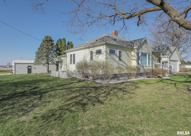 exterior space with a chimney and a front yard