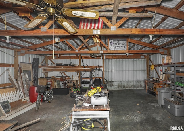 garage featuring ceiling fan and metal wall