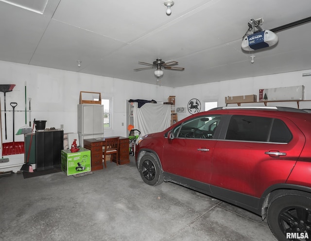 garage featuring a garage door opener and a ceiling fan