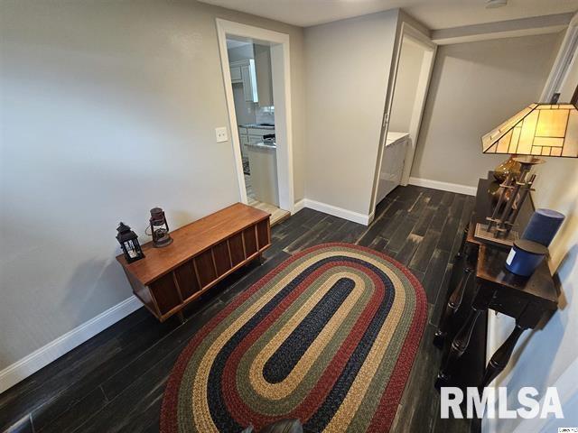 306 Walker St, Ursa, IL 62376 - living area with baseboards and wood finished floors