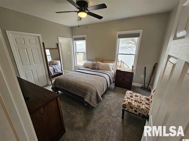 306 Walker St, Ursa, IL 62376 - carpeted bedroom with baseboards and ceiling fan