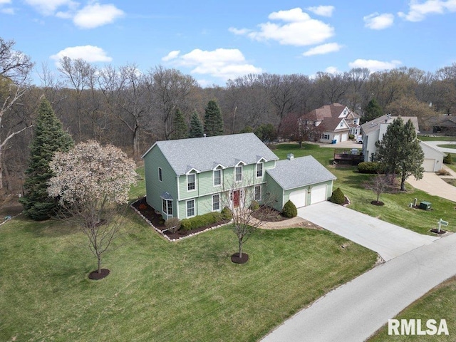 drone / aerial view featuring a view of trees