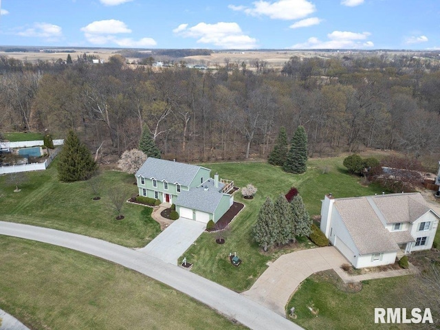 bird's eye view featuring a forest view
