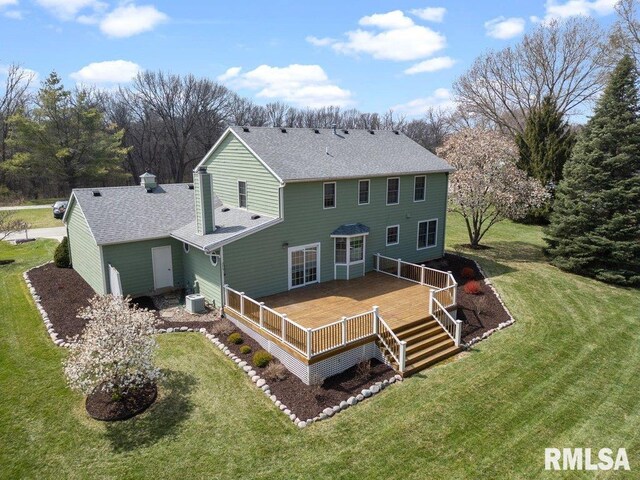 back of house with a yard, a wooden deck, central AC unit, and roof with shingles
