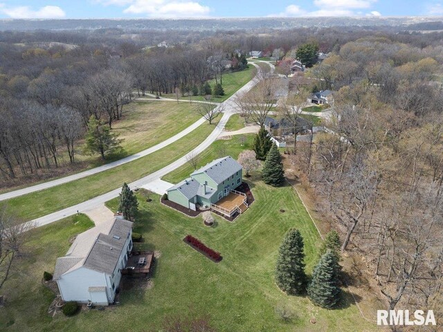 bird's eye view featuring a forest view