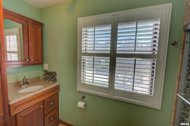 bathroom with vanity and a wealth of natural light