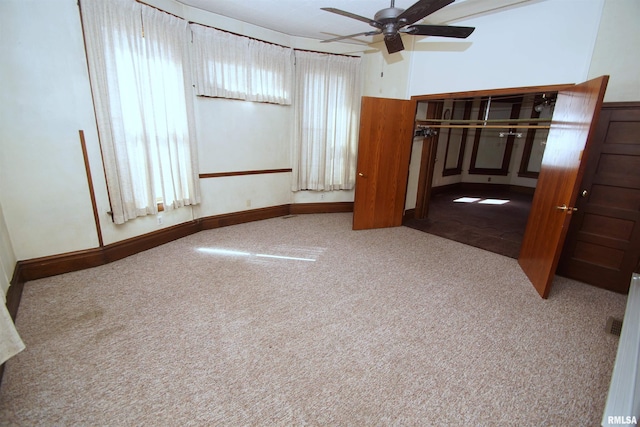 unfurnished bedroom featuring carpet flooring and a ceiling fan