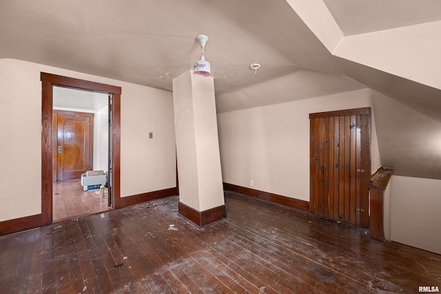408 E Henry St, Atkinson, IL 61235 - bonus room featuring hardwood / wood-style flooring, baseboards, and lofted ceiling