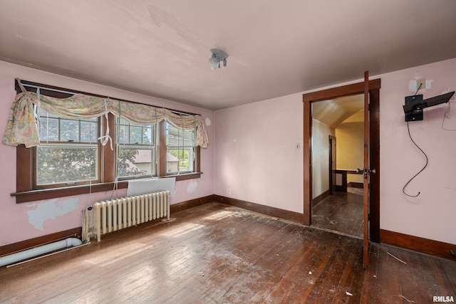 408 E Henry St, Atkinson, IL 61235 - spare room with radiator, wood-type flooring, and baseboards