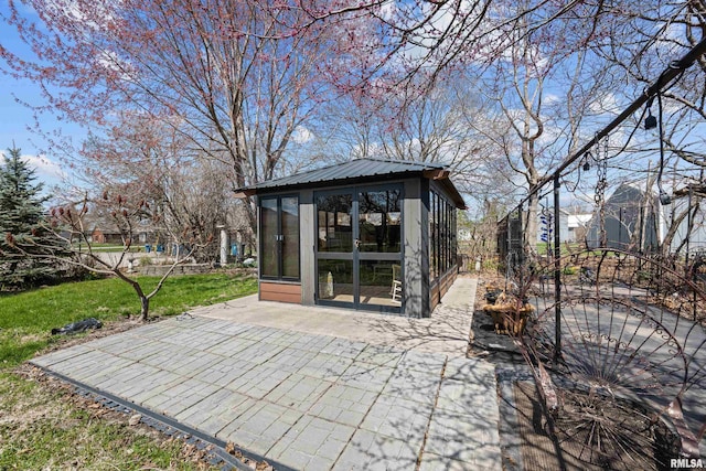 408 E Henry St, Atkinson, IL 61235 - view of outdoor structure featuring a sunroom