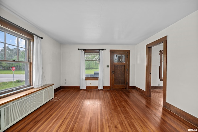 408 E Henry St, Atkinson, IL 61235 - entryway with radiator heating unit, hardwood / wood-style floors, and baseboards