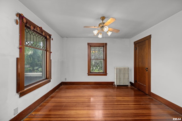 408 E Henry St, Atkinson, IL 61235 - empty room with radiator, wood finished floors, baseboards, and ceiling fan