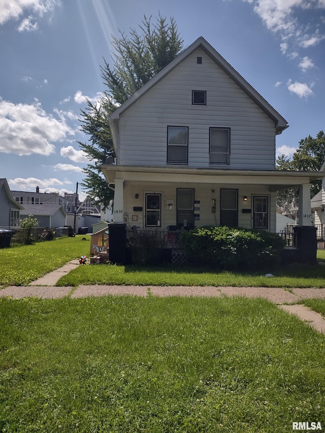 view of front of home featuring a porch and a front lawn