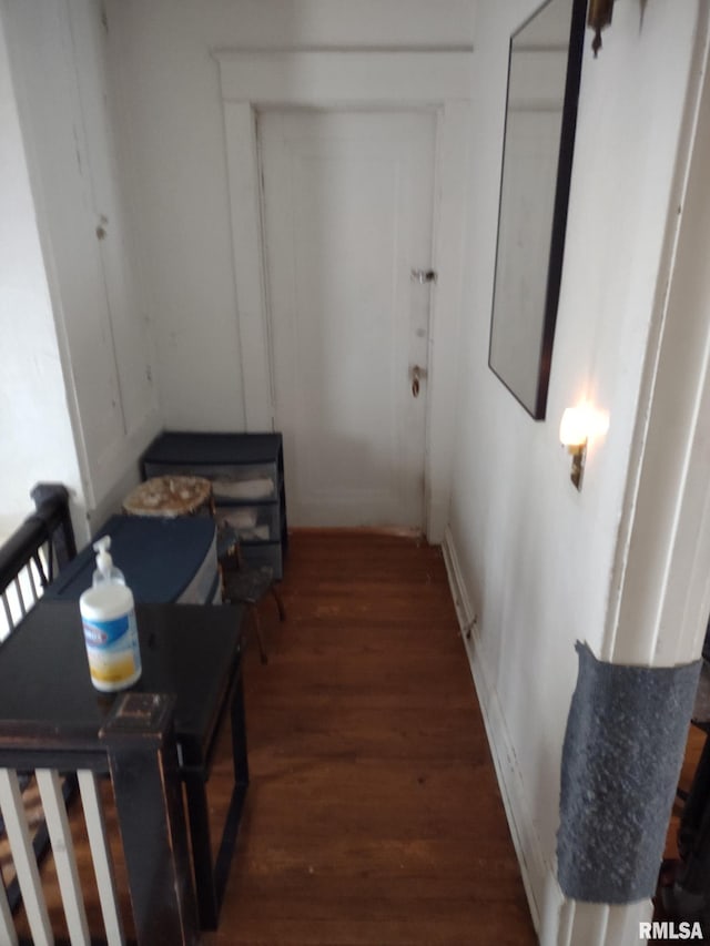 hall with wood finished floors