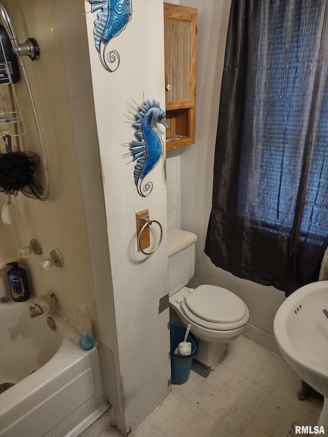 full bath with tile patterned floors, toilet, and shower / bathtub combination