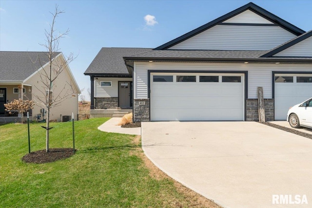 view of front of property with concrete driveway, a garage, stone siding, and a front yard