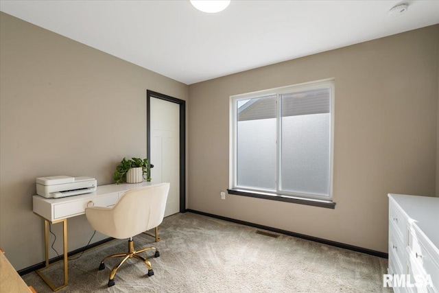office area with light colored carpet, baseboards, and visible vents