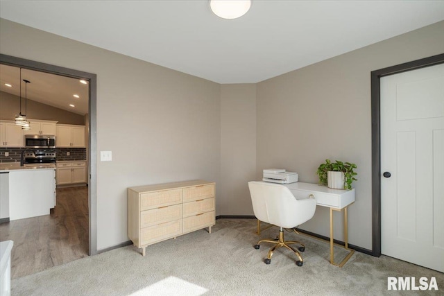 office space with baseboards, a sink, carpet, recessed lighting, and lofted ceiling