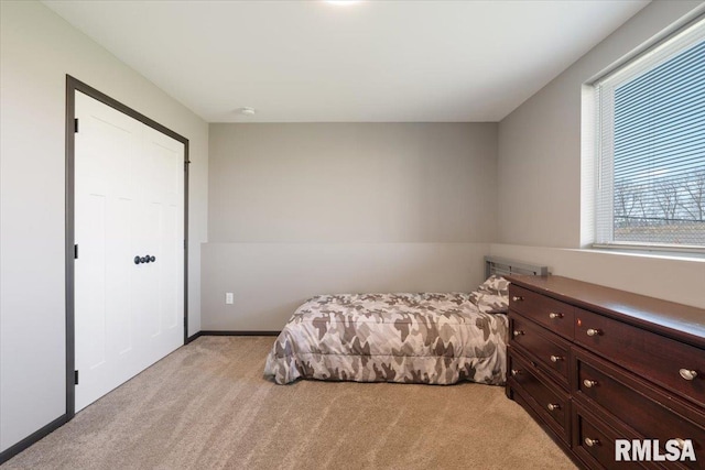 bedroom featuring light colored carpet
