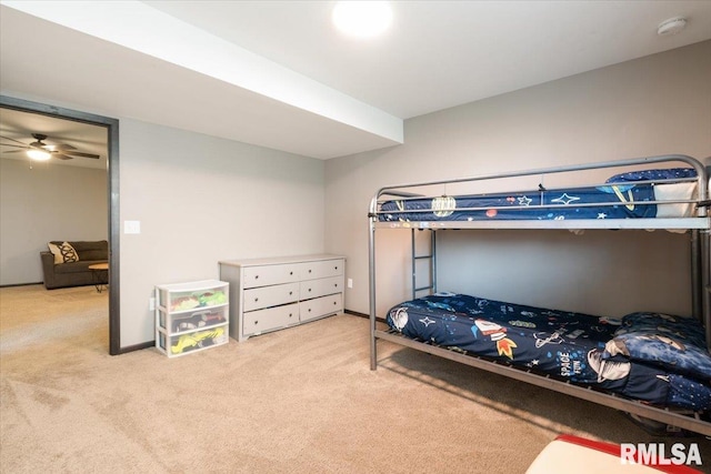 carpeted bedroom featuring baseboards