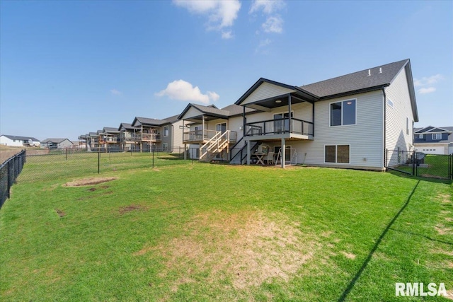 back of house featuring a yard, a fenced backyard, a residential view, and stairway