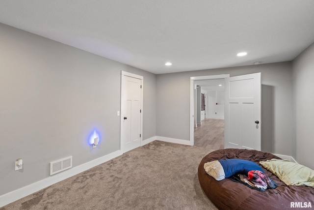 bedroom with light colored carpet, baseboards, visible vents, and recessed lighting