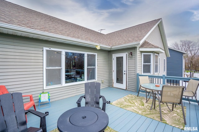 deck with outdoor dining area