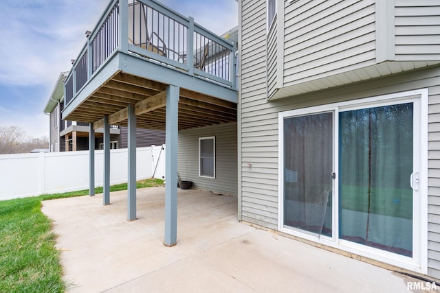view of patio / terrace featuring a wooden deck and fence
