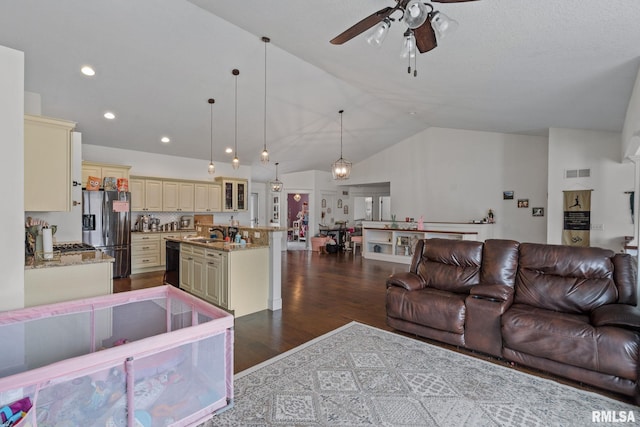 living area featuring ceiling fan, dark wood-type flooring, vaulted ceiling, visible vents, and recessed lighting