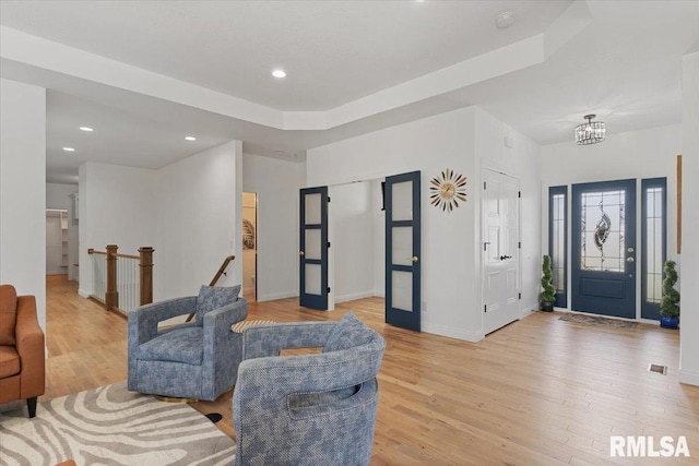 6817 Timber Ct, Bettendorf, IA 52722 - living area with light wood-type flooring, baseboards, and recessed lighting