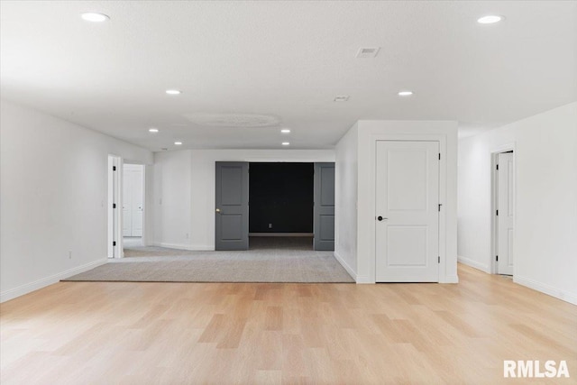 6817 Timber Ct, Bettendorf, IA 52722 - empty room with light wood-style flooring, recessed lighting, and baseboards