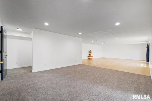 6817 Timber Ct, Bettendorf, IA 52722 - below grade area with carpet and recessed lighting