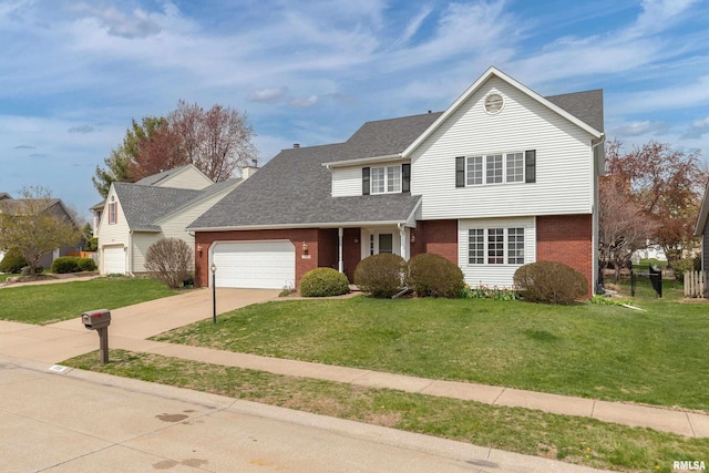 traditional home with brick siding, driveway, an attached garage, and a front lawn