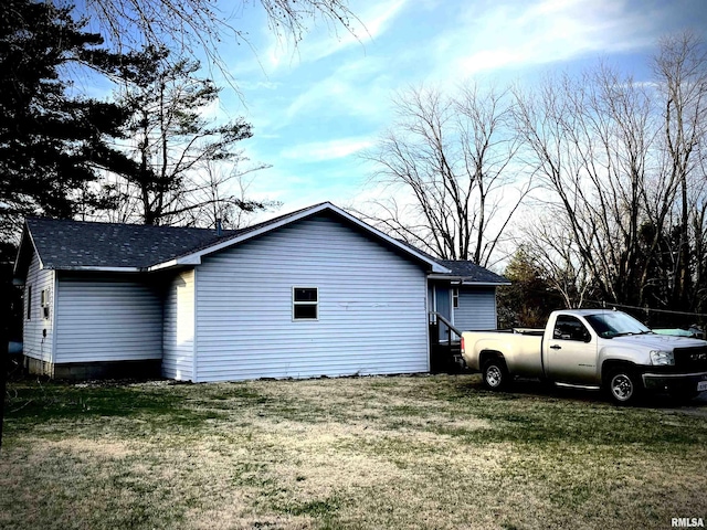 225 Arrowhead Dr, Goreville, IL 62939 - view of side of home featuring roof with shingles and a lawn