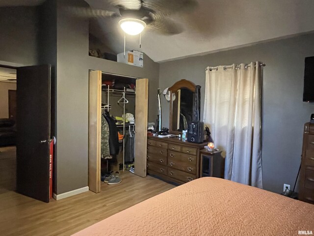 225 Arrowhead Dr, Goreville, IL 62939 - bedroom with ceiling fan, a closet, vaulted ceiling, and wood finished floors