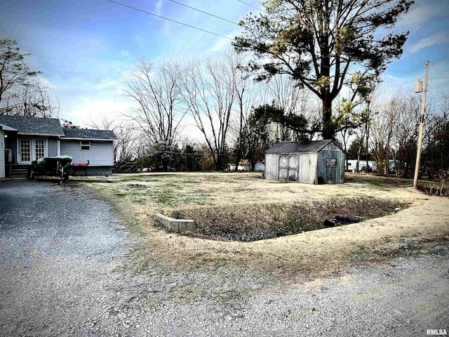 225 Arrowhead Dr, Goreville, IL 62939 - view of yard featuring an outbuilding and a shed