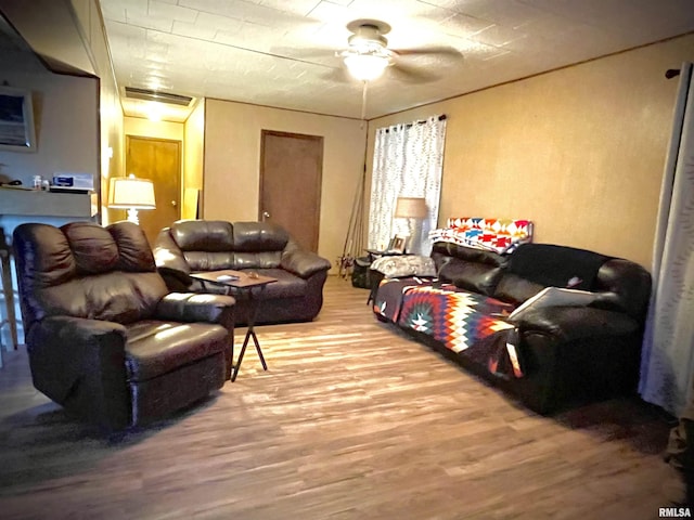 225 Arrowhead Dr, Goreville, IL 62939 - living area with a ceiling fan and wood finished floors