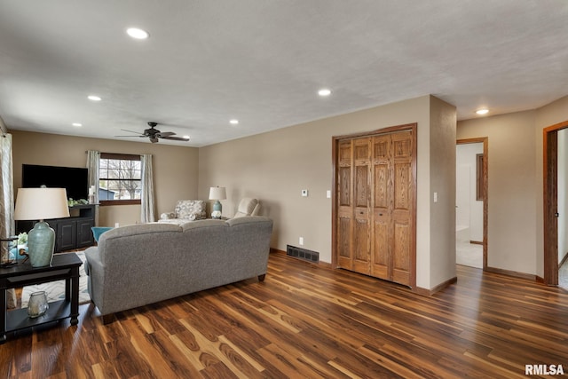 living area featuring dark wood-type flooring, visible vents, ceiling fan, and recessed lighting
