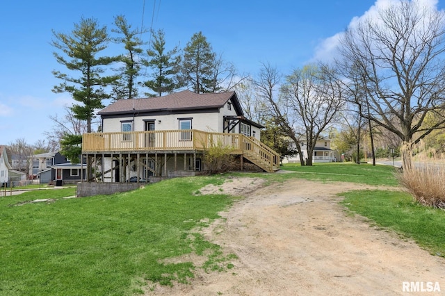 back of property featuring stairs, a wooden deck, a lawn, and dirt driveway