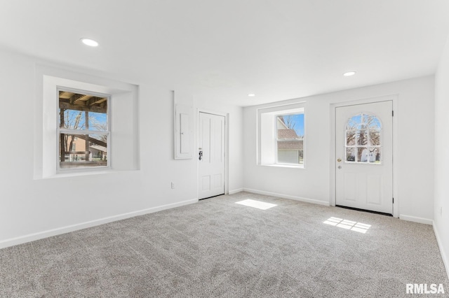 entrance foyer with baseboards, recessed lighting, and carpet flooring