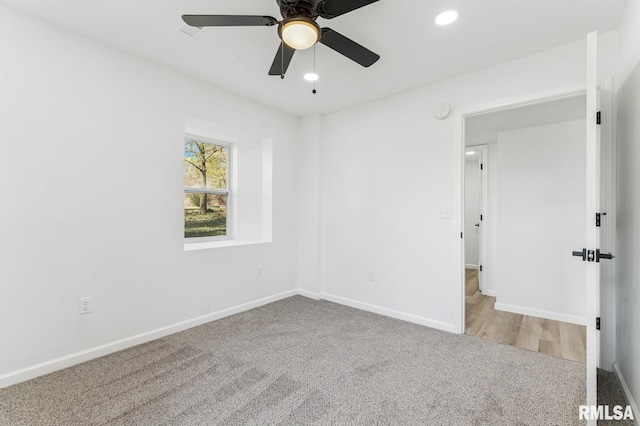 empty room with ceiling fan, recessed lighting, carpet flooring, and baseboards