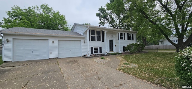 1606 Middle Rd, Camanche, IA 52730 - split foyer home featuring concrete driveway and a garage