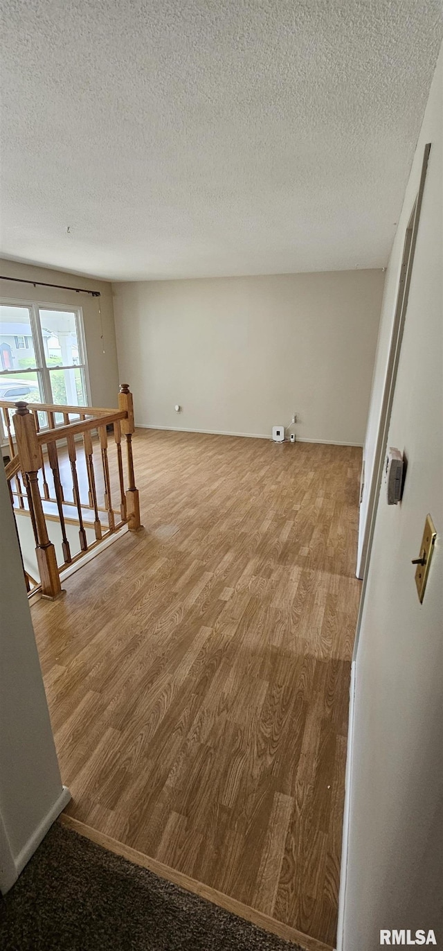 1606 Middle Rd, Camanche, IA 52730 - empty room featuring wood finished floors and a textured ceiling