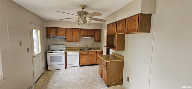 1606 Middle Rd, Camanche, IA 52730 - kitchen with white appliances, a sink, under cabinet range hood, brown cabinetry, and a ceiling fan